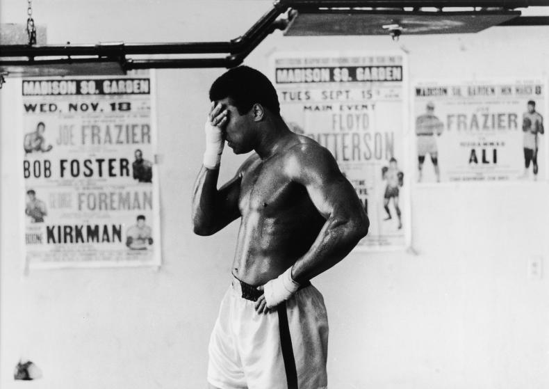 American heavyweight boxing champion Muhammad Ali covers his eyes with his hand during a training session at Chris Dundee's 5th Street gym, Miami Beach, 1971. (Photo by Chris Smith/Hulton Archive/Getty Images)