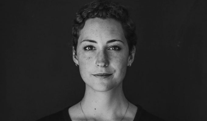 grayscale photo of woman wearing necklace and top